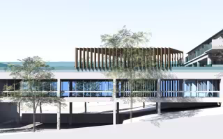 Pouponnière Les Lauriers Roses, perspective de la façade à pilotis surmontée d'un brise-soleil en bois