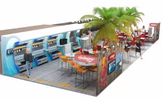 Espace Restauration Oxbow, perspective d'un comptoir à distributeurs et de tables hautes orange sous des palmiers, habillage en bois et visuels de surf