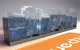 Création de Mobilier Quechua, perspective du comptoir à façade imprimée d'un paysage de montagne et logo orange au sol
