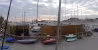 Aire de Carénage Bandol, vue panoramique de l'aire de carénage devant le port, bateaux stockés derrière des palissades en bois